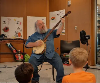 man playing banjo