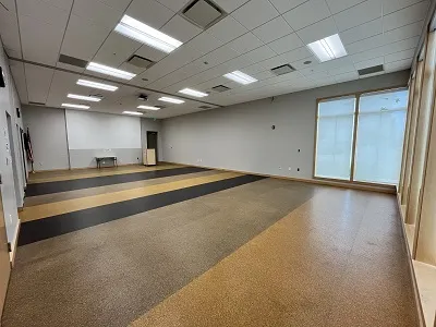 large multipurpose room with large corner windows